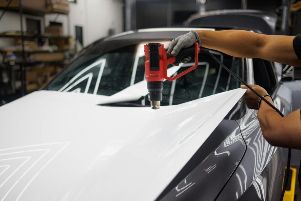 Heat Gun A heat gun is being used for car maintenance.